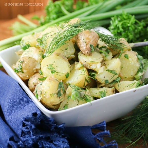 Herbed Potato salad in a white bowl 