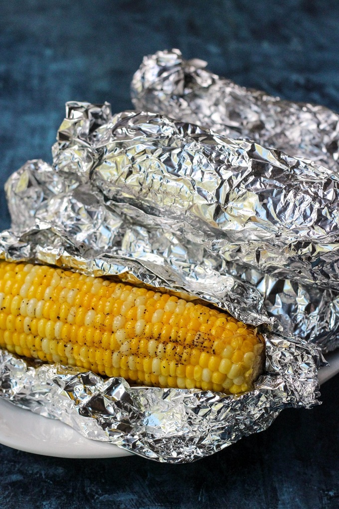Grilled corn on the cob in aluminum foil