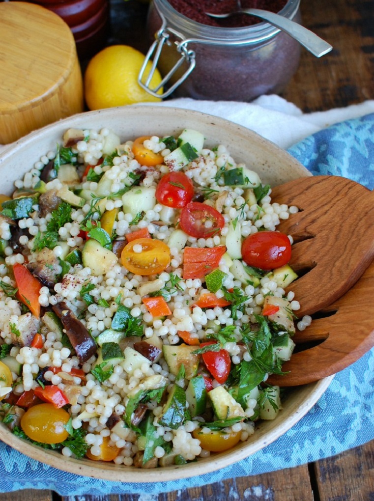Grilled vegetable and couscous salad in a white bowl