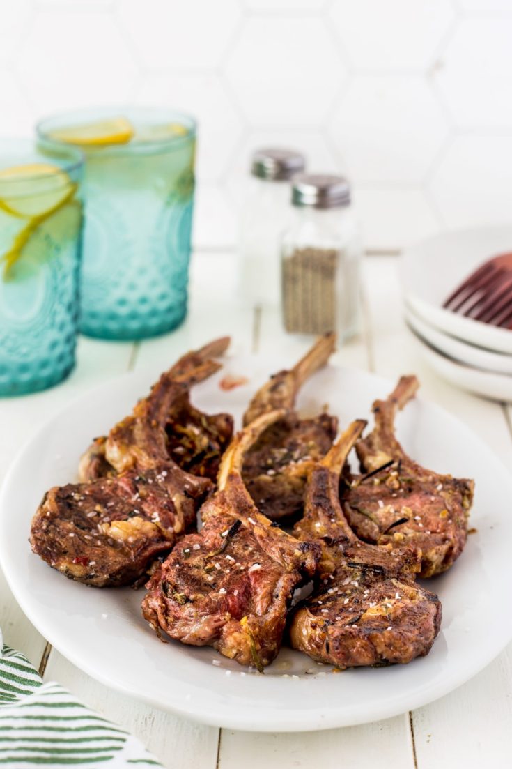 6 grilled lamb chops on a white platter