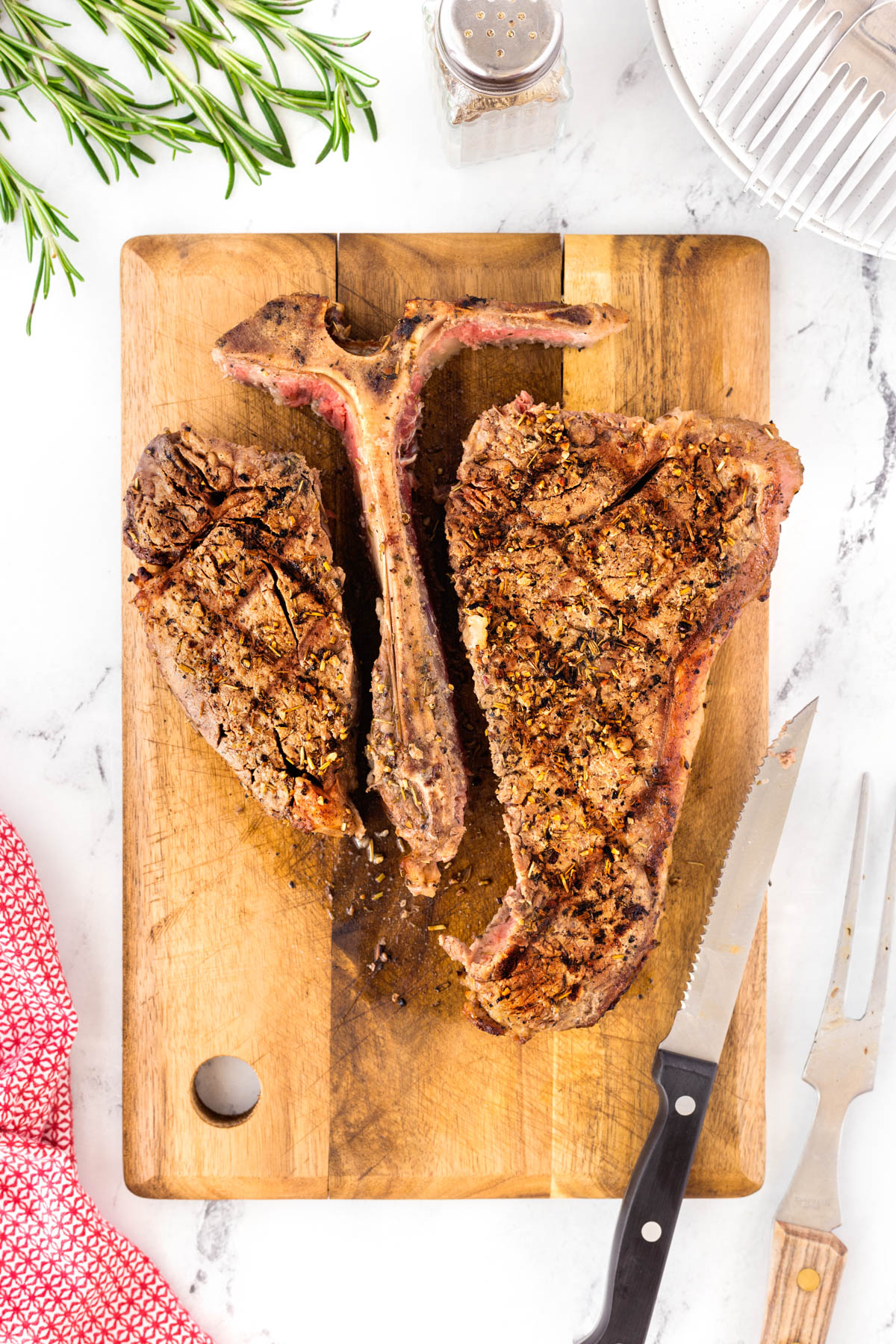 Grilled Porterhouse steak with the meat sliced away form the bone on both side of the T-bone.
