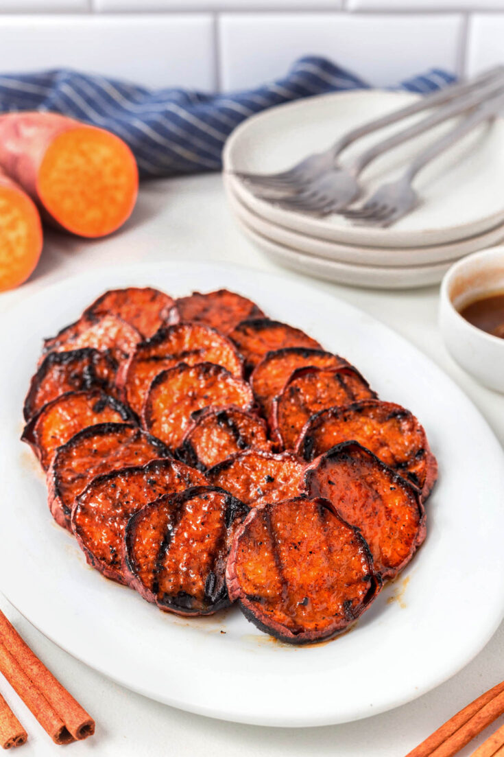 Grilled Sweet Potato slices on a white plate.