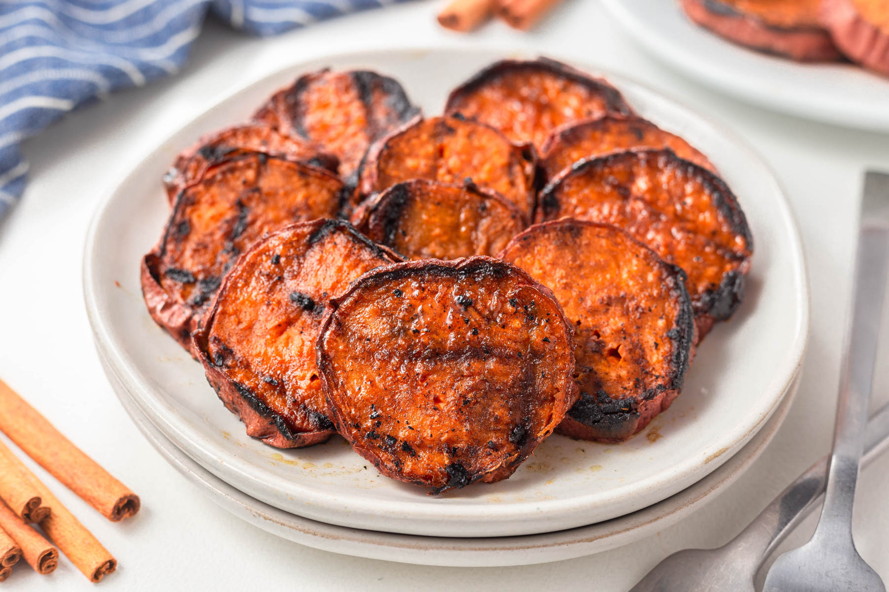 Grilled Sweet potatoes served on a white platter.