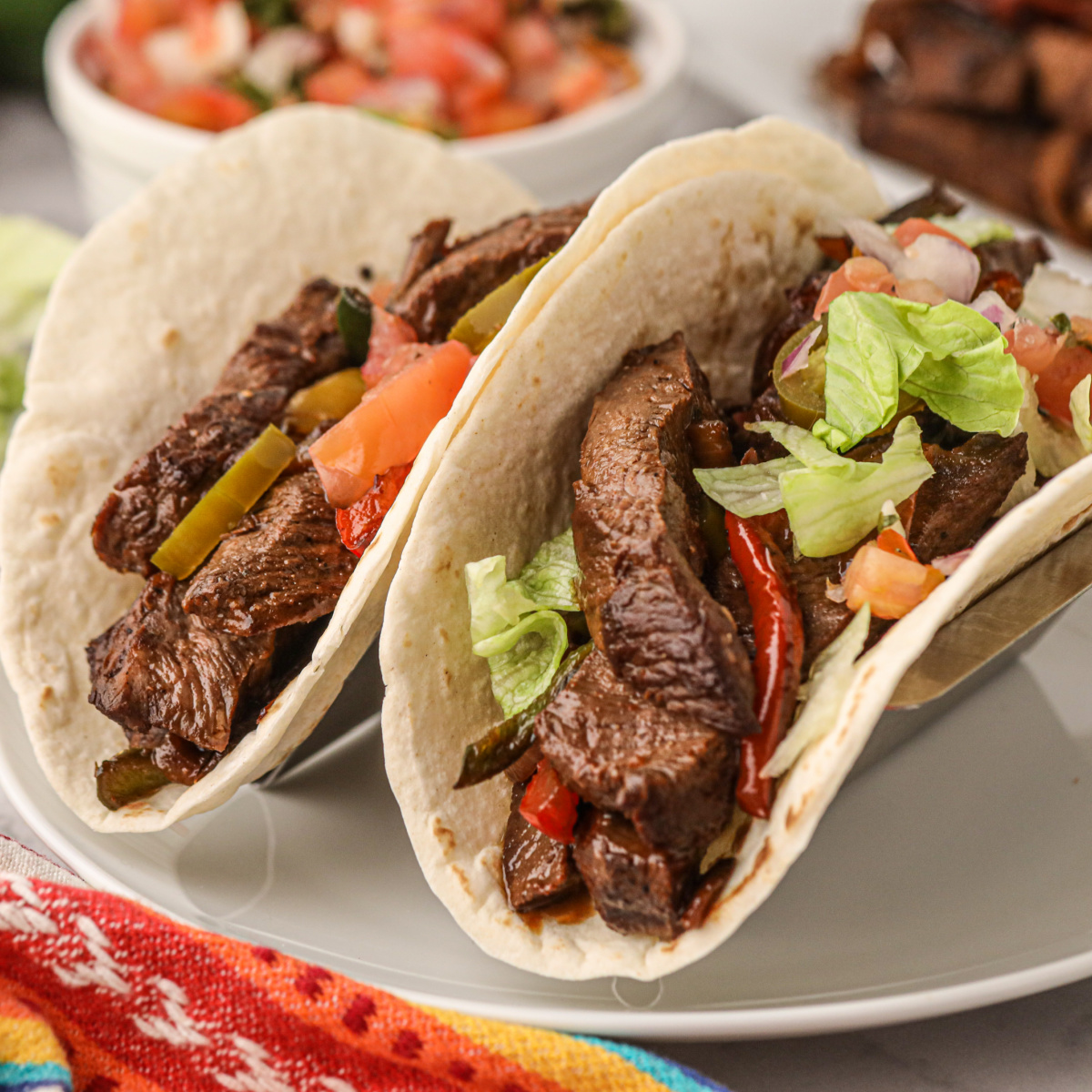 Grilled skirt steak fajitas on a plate ready to eat!