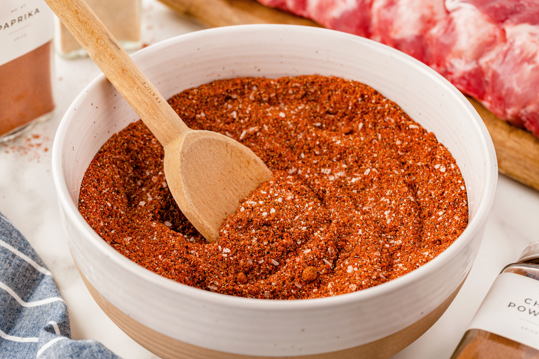 BBQ rub ingredients mixed together in a white bowl.