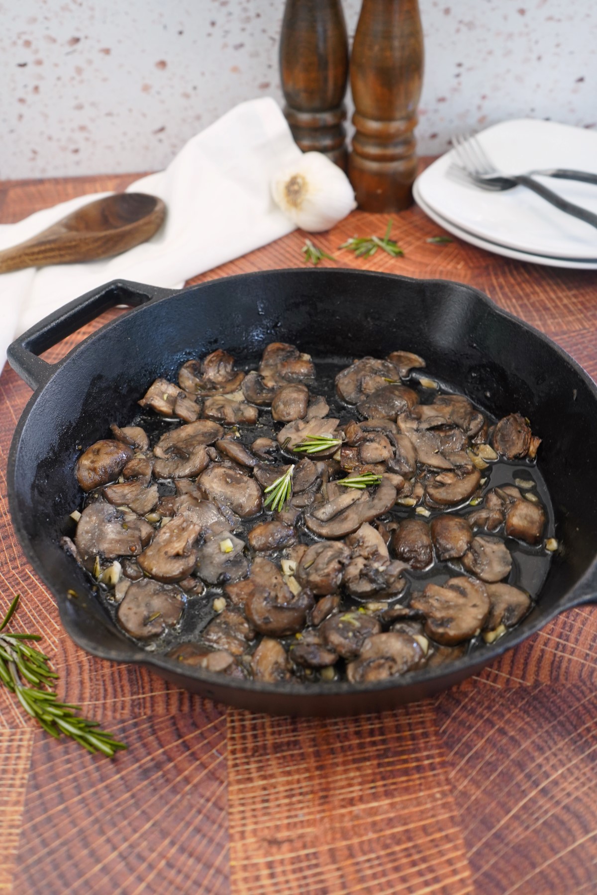Rosemary Smoked Mushrooms in a cast iron skillet.